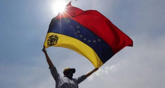 Tension Grows Between US and Russia over Venezuela standoff Demonstrator Caracas 800x450 550x295 - Tension Grows Between US and Russia over Venezuela standoff