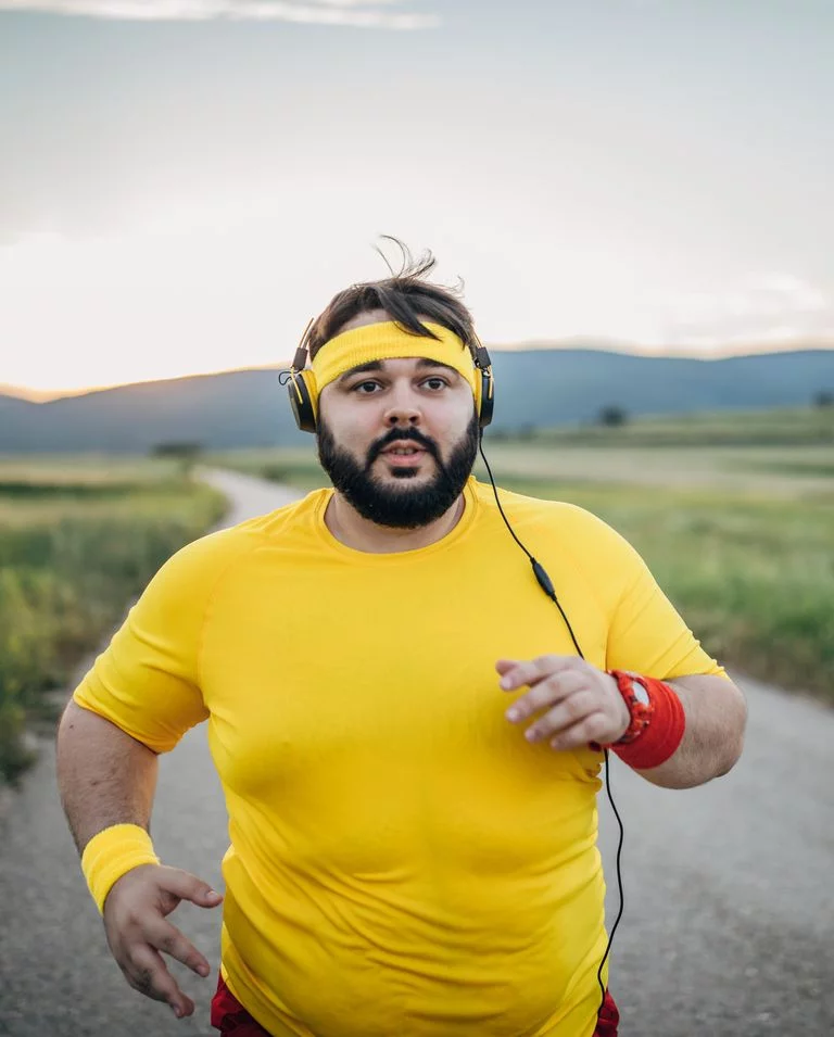 large man jogging on the street in sunset royalty free image 1578521590 - How to Tighten Loose Skin After Weight Loss