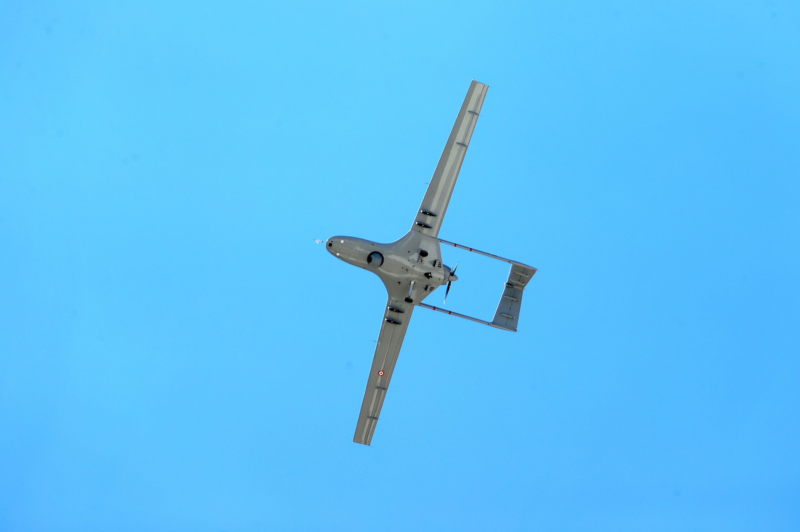 drone flying in the clear blue sky